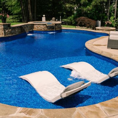 custom pool tanning ledge water feature